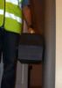 man in a high vis jacket with a toolbox walking past a Foam Door Frame Protectors