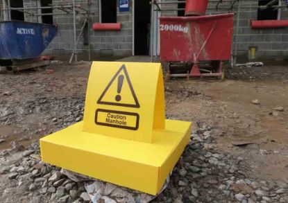 Yellow Manhole Protector in a construction site